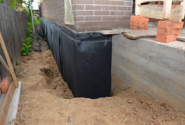 Happy homeowners after waterproofing job in Bronson